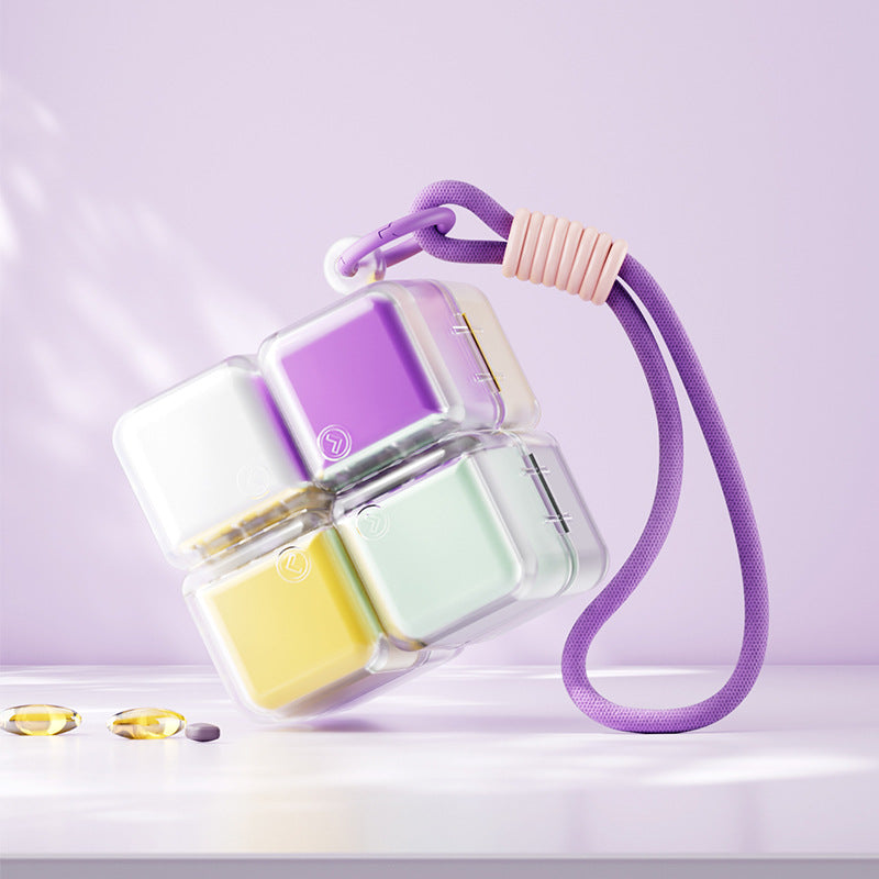 A portable medication organizer designed in the shape of a Rubik's Cube, featuring a lanyard for convenient carrying, a high-capacity dispensing compartment, and a sealed, moisture-resistant storage container organized for daily use across seven days.