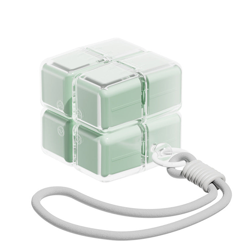 A portable medication organizer designed in the shape of a Rubik's Cube, featuring a lanyard for convenient carrying, a high-capacity dispensing compartment, and a sealed, moisture-resistant storage container organized for daily use across seven days.